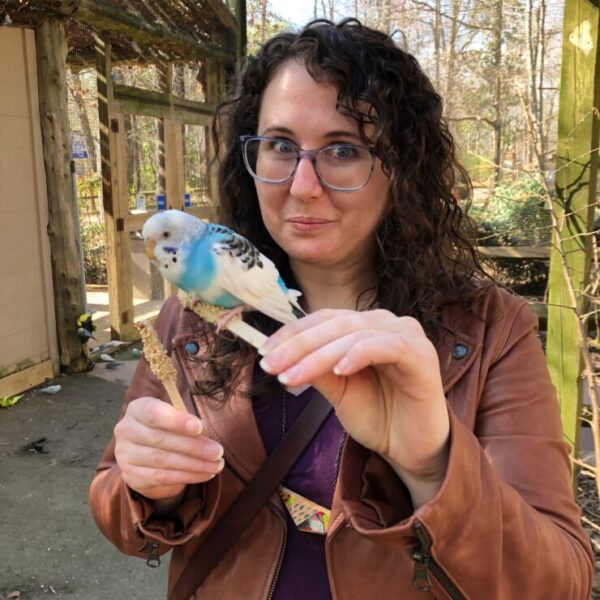 Photo of Kari Martin Hollinger holding a bird