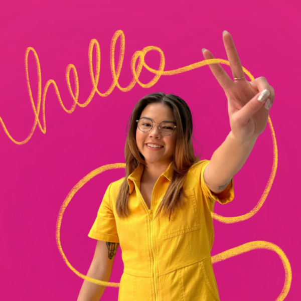 Headshot of Sarah Klotz with a pink background in a yellow outfit with hello written on the photo