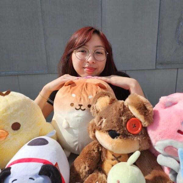 Photo of Victoria Nguyen with stuffed animals