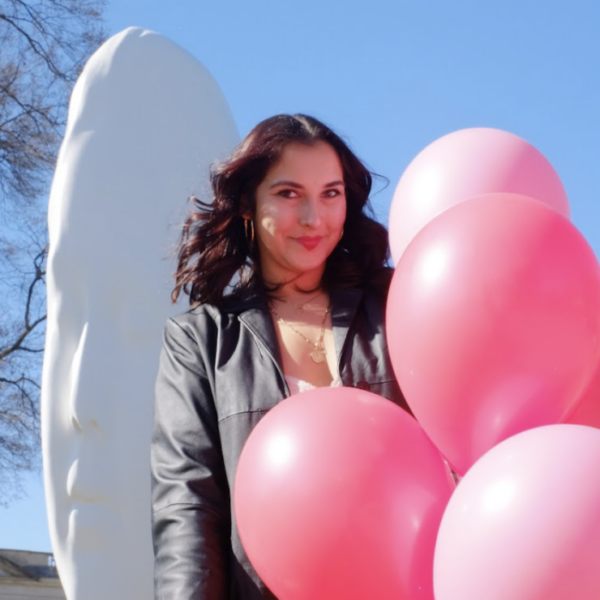Headshot of Alley Steele holding pink balloons