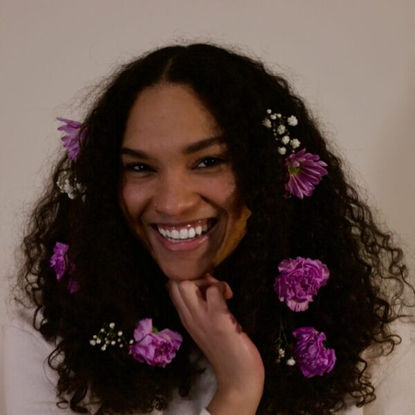 Photo of Nina Stitt with flowers in her hair