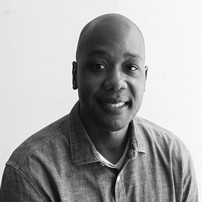 A black and white headshot of Howard Jordan