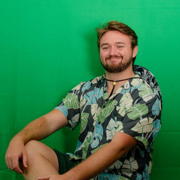 Headshot of Jack Demare in front of a green screen