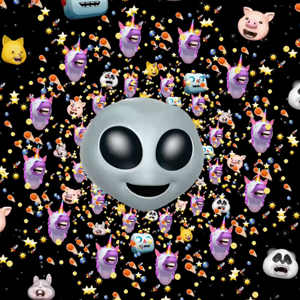 Screengrab of an Apple commercial for the iPhone X with the alien animoji in the center and other animoji styles surrounding the alien