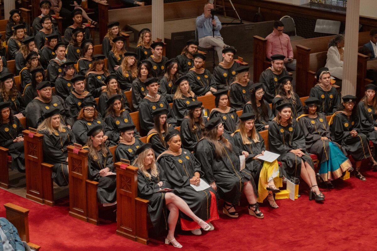 image of all the grads sitting in pews