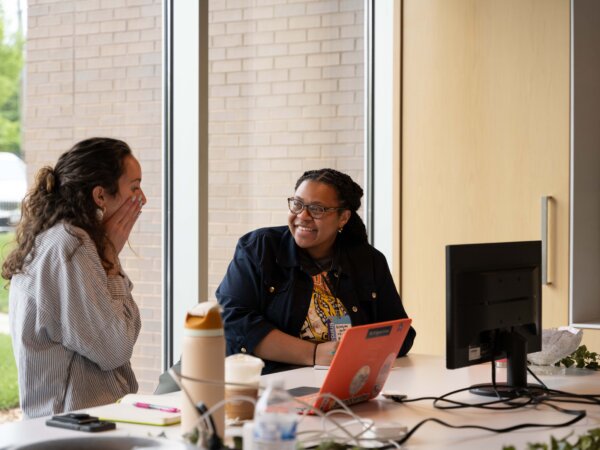 two people talking to each other animatedly