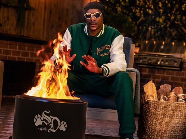 still from an add showing snoop by a fire in a solo stove firepit