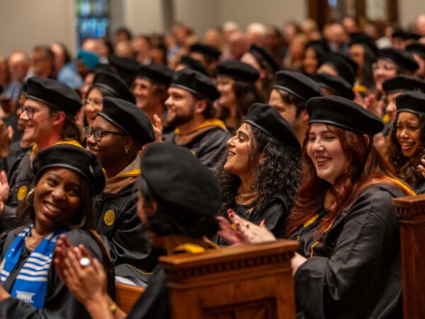 students sitting during ceremony