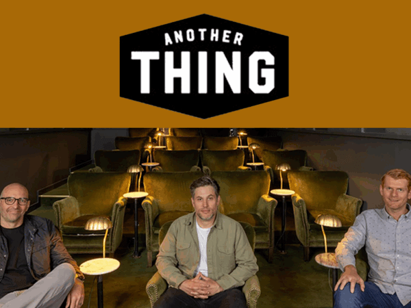 nick pictured with another things co founders and another thing logo