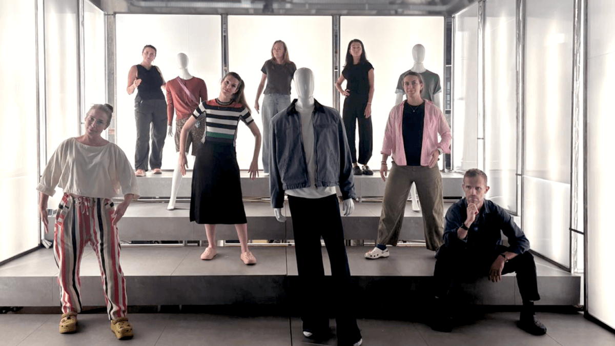 hope and other team members on set posing as mannequins